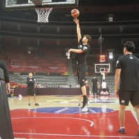 Japan forward Kosuke Takeuchi shoots a hook shot during his individual practice at Dongguan Basketball Center on Sunday. | KAZ NAGATSUKA
