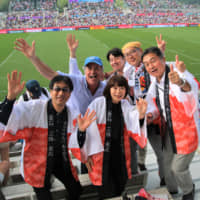 Fans enjoy the Rugby World Cup match between Uruguay and Fiji in Kamaishi, Iwate Precture, on Wednesday. | KAZ NAGATSUKA