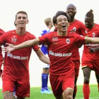 Antwerp\'s Koji Miyoshi (front) celebrates after scoring the game-winning goal in his debut for the club against Anderlecht on Sunday in Anderlecht, Belgium. | KYODO