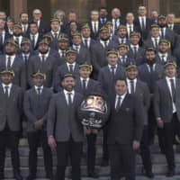 The New Zealand All Blacks pose for a group photo after the team\'s welcome ceremony for the Rugby World Cup at Zojoji Temple on Saturday. | AP