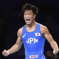 Shinobu Ota reacts after winning the gold medal in the 63-kg category at the Greco-Roman world championships on Sunday in Nur-Sultan. | AP