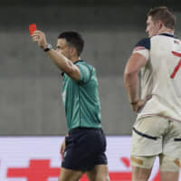 Referee Nic Berry shows a red card to U.S. flanker John Quill in a Rugby World Cup Pool C game against England on Thursday in Kobe. | AP