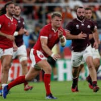 Wales\' Dan Biggar passes the ball against Georgia during a Rugby World Cup Pool D match on Monday at Toyota Stadium. | AFP-JIJI