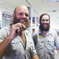 World travelers Ron Rutland (left) and James Owens arrived in Japan on Thursday. Roland holds the whistle that referee Nigel Owens will use to signal the start of the Rugby World Cup opener on Sept. 20 in Tokyo. | KYODO