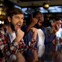 A sports bar filled with fans can be the best place to watch the big game. | GETTY IMAGES