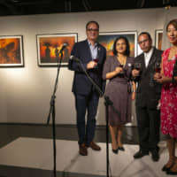 The opening ceremony of exhibition \"Septiernos: Pueblos del Oriente Boliviano\'\' at Tokyo Instituto Cervantes. From left: Instituto Cervantes Tokio Director Victor Ugarte; Angela Ayllon, the Charge d\'Affaires at the Embassy of Bolivia; Bolivian Photographer Joaquin Carvajal, whose work conveys cultural visualizations such as indigenous nature in the forest area of eastern Bolivia; and Miwa Okubo of Tokyo Instituto Cervantes.   | PHOTO COURTESY OF BOLIVIAN EMBASSY