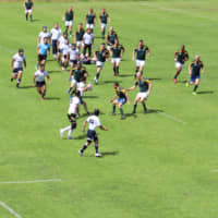 The Japan-Georgia team in white jerseys plays against South Africa team. | FUJIKAWAGUCHIKO TOWN