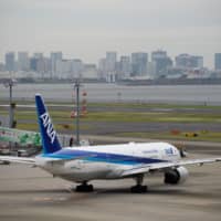 An All Nippon Airways Co. aircraft taxis at Haneda Airport in Tokyo. | BLOOMBERG