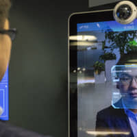 Xu Li, chief executive officer of SenseTime Group Ltd., is identified by the company\'s facial recognition system at SenseTime\'s showroom in Beijing in June 2018. | BLOOMBERG
