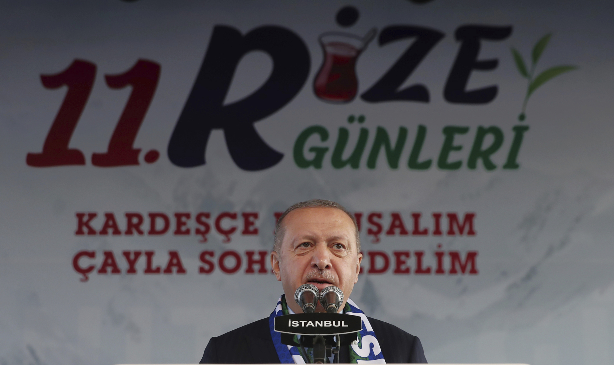 Turkish President Recep Tayyip Erdogan addresses his supporters during an event called 'Let's stop smoking, let's drink Rize tea ' in his Black Sea hometown, Rize, Turkey, Sunday. | PRESIDENTIAL PRESS SERVICE / VIA AP