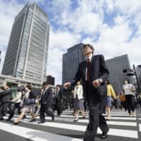 The Cabinet Office estimates that a bilateral trade agreement between Japan and the United States will boost Japan\'s gross domestic product by around 0.8 percent. | BLOOMBERG