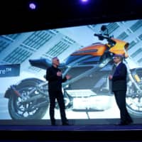 Marc McAllister, vice president of Harley-Davidson, talks about the Harley-Davidson LiveWire electric motorcycle with Tom Gebhardt, chairman and CEO for Panasonic Corporation of North America, during a Panasonic news conference at the 2019 Consumer Electronics Show (CES) in Las Vegas in January. | REUTERS