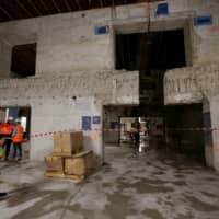 Technicians work at the construction site of the Interxion MRS3 data center installed in an old German submarine base built during the Second World War in Marseille, France, Tuesday. | REUTERS