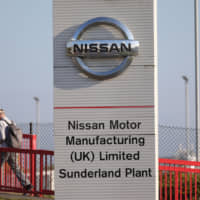 A worker leaves the Nissan car plant after finishing for the day in Sunderland, northeast England, in 2016. Nissan will review its decision to make a new Qashqai car in Britain if there is a no-deal Brexit, a source with knowledge of the matter told AFP Tuesday. The source confirmed media speculation over the potential reversal of the sport utility vehicle\'s production at Britain\'s biggest car factory. | AFP-JIJI