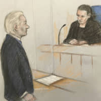 A sketch by Elizabeth Cook shows Julian Assange facing District Judge Vanessa Baraitser at Westminster Magistrates\' Court in London on Monday. | AP