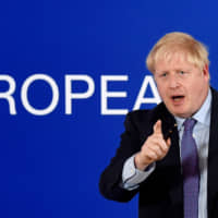 British Prime Minister Boris Johnson leaves a news conference at the European Union summit in Brussels on Thursday. | REUTERS
