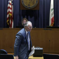 Pacific Gas and Electric Company CEO Bill Johnson attends a California Public Utilities Commission meeting in San Francisco on Friday. | AP