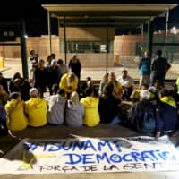 Protesters gather outside Lledoners jail in support of the jailed Catalan separatist leaders, in Sant Joan de Vilatorrada, north of Barcelona, Spain, Sunday. | REUTERS