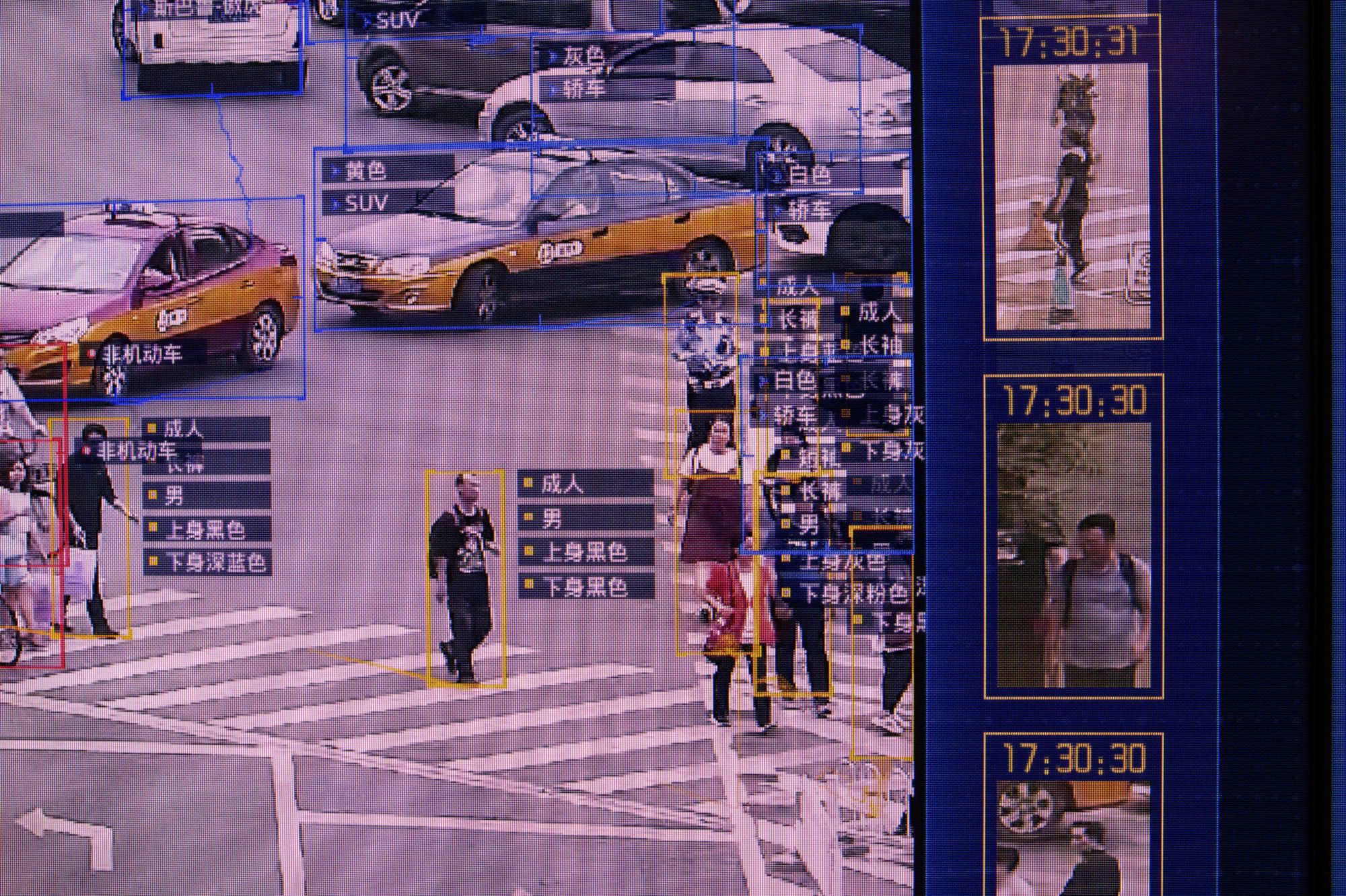 Screen captures of videos showing Sensetime artificial intelligence software on display at the company's showroom in Beijing in June 2018 | BLOOMBERG