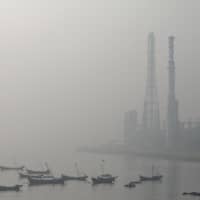 Haze shrouds Dalian Bay in China\'s Liaoning province on Tuesday. | REUTERS
