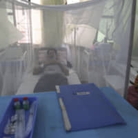 A Pakistani patient with dengue fever, a mosquito-borne disease, rests in a hospital in Karachi, Pakistan, Wednesday. A top Pakistani health official said authorities are battling one of the worst-ever dengue fever outbreaks across the country, including the capital, Islamabad, as hospitals continued to receive scores of patients, putting strain on the poor emergency services. | AP