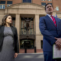 Attorney General for the Eastern District of Virginia G. Zachary Terwilliger (right), accompanied by Assistant United States Attorney Danya Atiyeh, takes a question from a reporter after announcing the arrest of Henry Kyle Frese, a Defense Intelligence Agency official charged with leaking classified information to two journalists, including one he was dating, during a news conference outside the federal courthouse in Alexandria, Virginia, Wednesday,. | AP