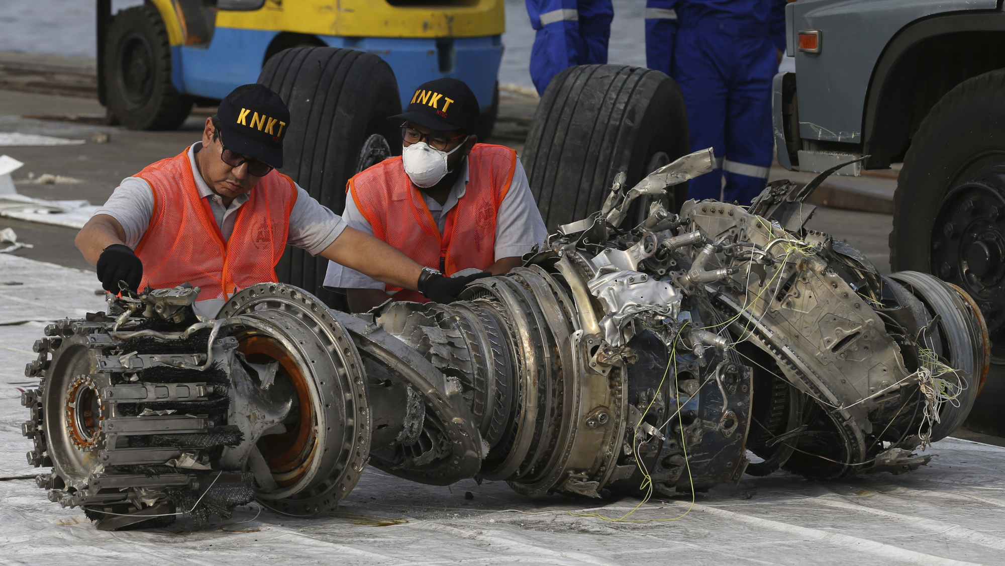 Officials inspect an engine of the crashed Lion Air jet on Nov. 4, 2018, in Jakarta. | AP