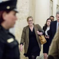 Catherine Croft, a State Department adviser on Ukraine, leaves after testifying at a closed-door meeting as part of the House impeachment inquiry into President Donald Trump on Capitol Hill in Washington Wednesday. | AP