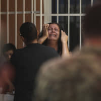 The mother of Alfredo Gonzalez Munoz, a Mexican soldier who died during a massive gunbattle with a drug cartel in Culiacan, cries during his wake in Veracruz on Saturday. | AP