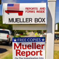 A sign for free copies of The Mueller Report is displayed on the mailbox of Nick and Louise Brooke in Oklahoma City Sept. 19. The couple are giving away free copies of the investigative report on Russia\'s interference in Donald Trump\'s 2016 presidential election. | CHRIS LANDSBERGER / THE OKLAHOMAN / VIA AP