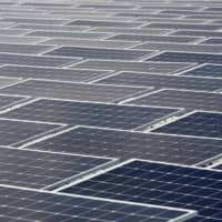 Floating photovoltaic solar panels are seen during the inauguration of the power plant O\'Mega 1 photovoltaic park in Piolenc, France, on Friday. | REUTERS