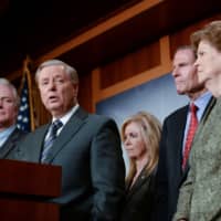 Sen. Lindsey Graham, joined by Sens. Chris Van Hollen, Marsha Blackburn, Richard Blumenthal and Jeanne Shaheen, announces a bipartisan agreement on Turkey sanctions during a news conference on Capitol Hill in Washington Thursday. | REUTERS