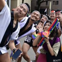Participants pose for a selfie while taking part in the annual gay pride parade in Taipei on Saturday. | AFP-JIJI
