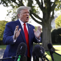 President Donald Trump speaks to members of the media on the South Lawn of the White House in Washington Thursday before boarding Marine One for a short trip to Andrews Air Force Base, Maryland, and then on to Minneapolis for a campaign rally. | AP