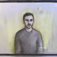 A court artist sketch by Elizabeth Cook shows truck driver Maurice Robinson, 25, on a video-link at Chelmsford Magistrates\' Court, England, Monday. Authorities found 39 people dead in a truck in an industrial park in England on Wednesday and arrested the driver on suspicion of murder in one of Britain\'s worst human-smuggling tragedies. | ELIZABETH COOK / PA / VIA AP