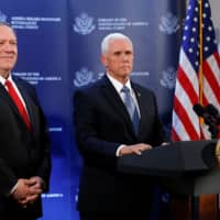 U.S. Vice President Mike Pence and U.S. Secretary of State Mike Pompeo attend a news conference at the U.S. Embassy in Ankara Thursday. | REUTERS
