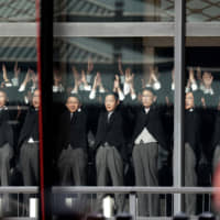 Officials shout banzai cheers for Emperor Naruhito and Empress Masako during the enthronement ceremony. | AFP-JIJI