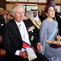 Prince Charles of the United Kingdom and Crown Princess Mary of Denmark watch the ceremony at the Imperial Palace. | KYODO
