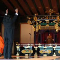 Prime Minister Shinzo Abe leads a banzai cheer for Emperor Naruhito and Empress Masako during the enthronement ceremony. | AFP-JIJI