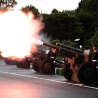 Members of the Self-Defense Forces fire artilleries to mark the proclamation of Emperor Naruhito\'s ascension to the throne at a park in Tokyo. | AFP-JIJI