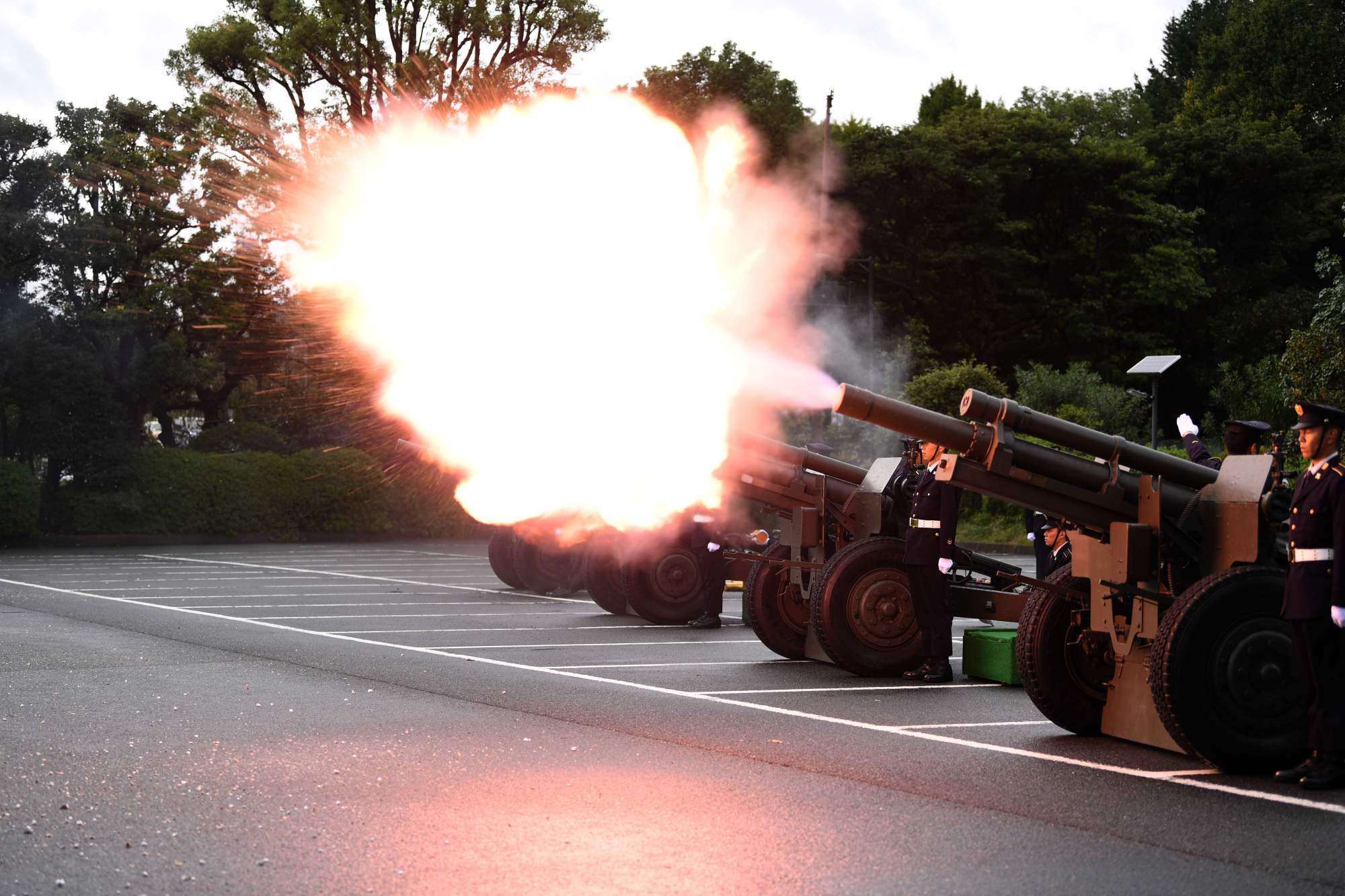 Members of the Self-Defense Forces fire artilleries to mark the proclamation of Emperor Naruhito's ascension to the throne at a park in Tokyo. | AFP-JIJI