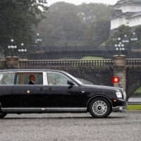 Emperor Naruhito arrives at the Imperial Palace on Tuesday. | REUTERS