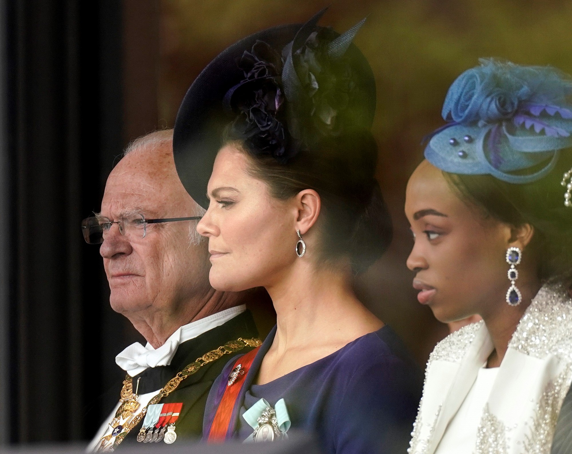 Swedish King Carl XVI Gustaf (left) and his daughter, Crown Princess Victoria (center), attend the enthronement ceremony. | POOL / VIA AFP-JIJI
