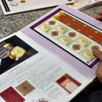 Commemorative stamps are sold in Tokyo\'s Marunouchi district on Tuesday. | SATOKO KAWASAKI