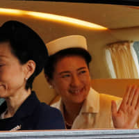 Empress Masako arrives at the Imperial Palace in Tokyo on Tuesday morning for the enthronement ceremony of Emperor Naruhito. | REUTERS