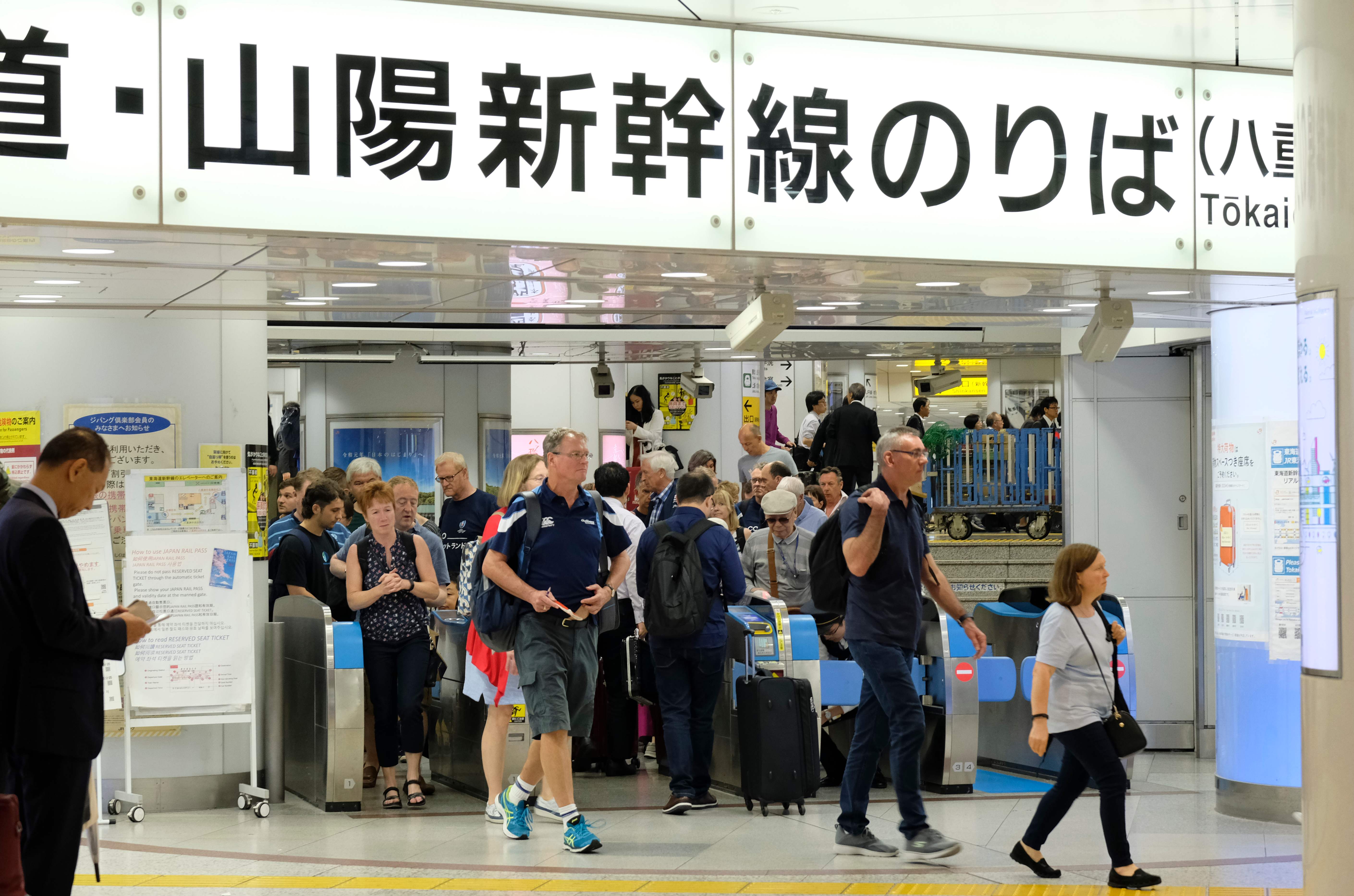 Foreign tourists arrive at JR Tokyo Station on Friday ahead of Typhoon Hagibis. | AFP-JIJI