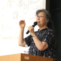 Ruiko Muto, the 66-year-old leader of the class action lawsuit against former Tepco executives, speaks at Utsunomiya University in Tochigi Prefecture on July 21. | KAHOKU SHIMPO