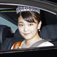 Princess Mako is driven to the Imperial Palace on Tuesday to attend a banquet held following Emperor Naruhito\'s enthronement ceremony. | KYODO