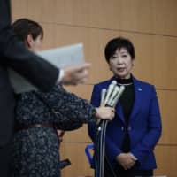 Tokyo Gov. Yuriko Koike speaks to reporters Wednesday at the metropolitan government office, where a three-day meeting with the International Olympic Committee began. Discussions are expected to focus on venues for marathon and race-walk events. | RYUSEI TAKAHASHI