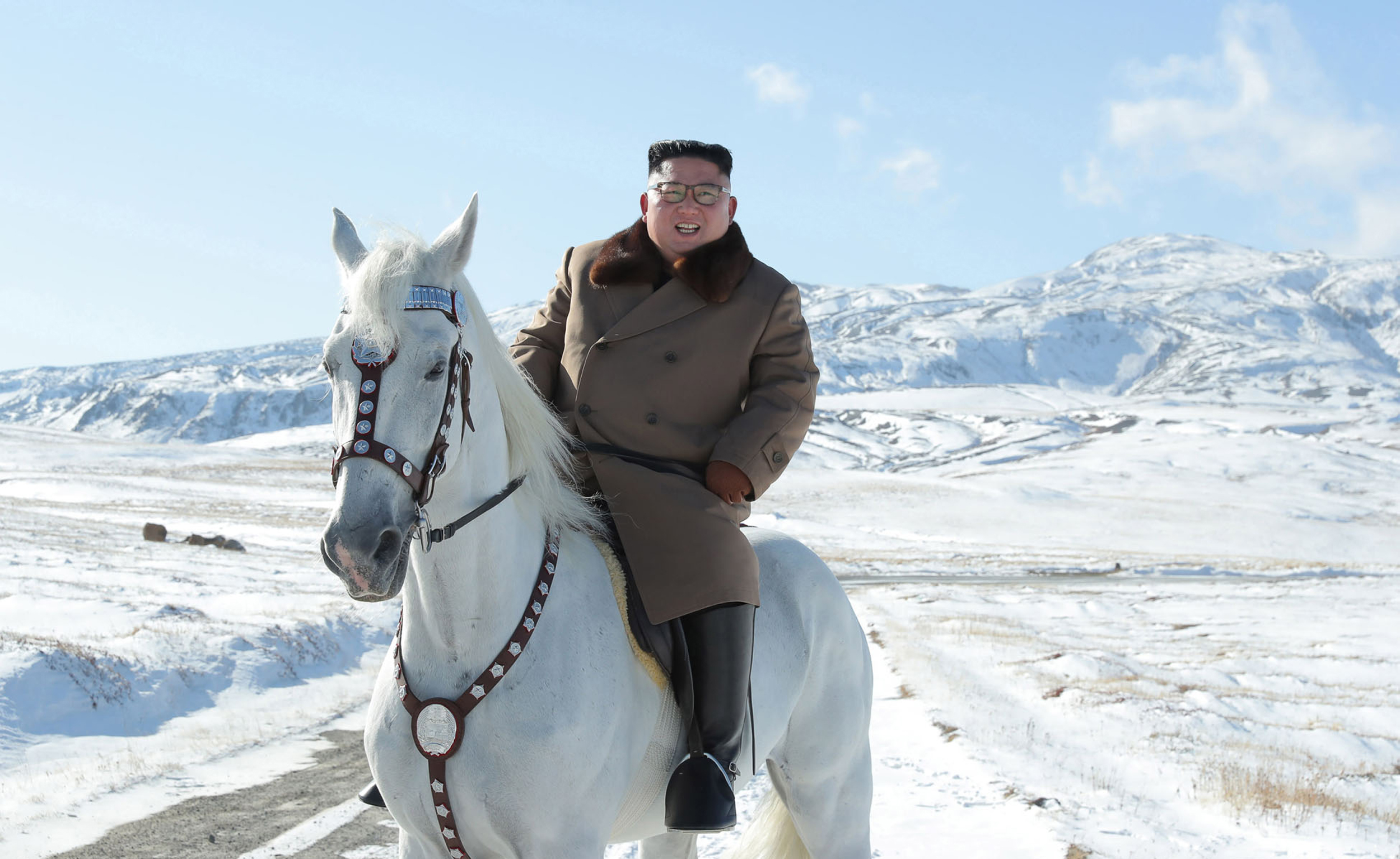 North Korean leader Kim Jong Un rises a white horse in the first snow at Mouth Paektu in this undated picture released last week. Vessels involved in the North's export of coal, which is banned under U.N. resolutions, have made repeated port calls in Japan, a report said Sunday. | KCNA / VIA AFP-JIJI